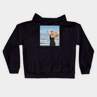 Sexy woman on the sea shore Kids Hoodie